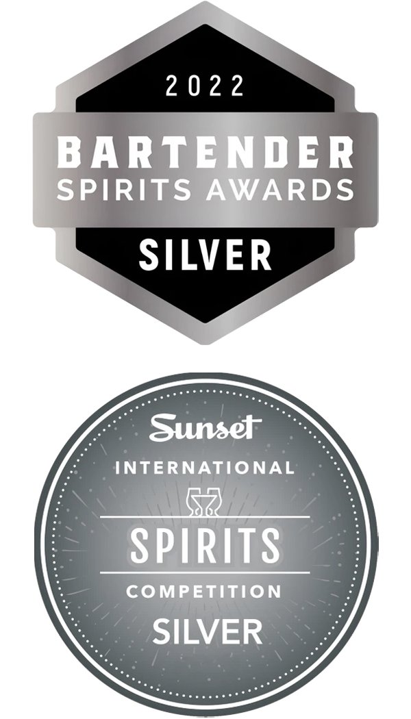 Two silver award badges for 2022 Bartender Spirits Awards and Sunset International Spirits Competition on a white background.